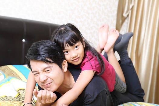 South East Asian young father mother daughter  parent girl child activity indoor photo