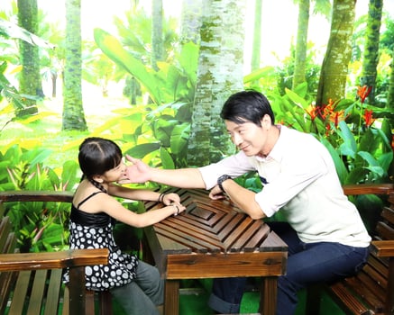 South East Asian young father mother daughter  parent girl child activity indoor photo
