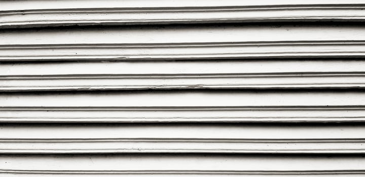 Close up line pattern of gray or grey wooden door for background in black and white tone photo