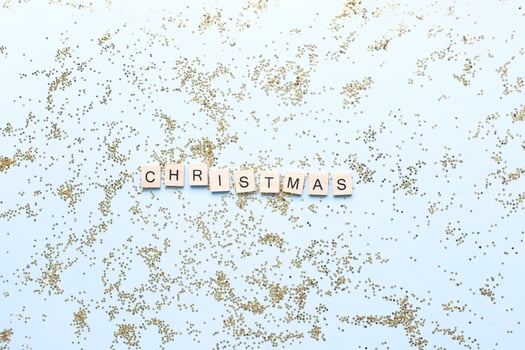 Word christmas from wooden letters on glitters. Shine. Star sequins photo