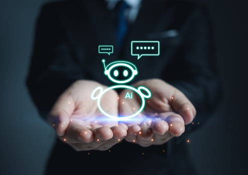 Businessman hand holding an AI model. Show chat with ai system. Concept of network communication. chat bot concept. photo
