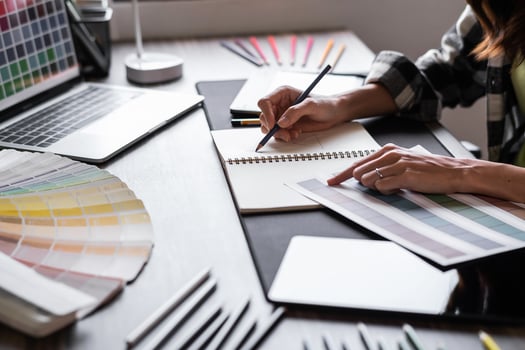 Graphic designer working with sketching logo design at office. photo
