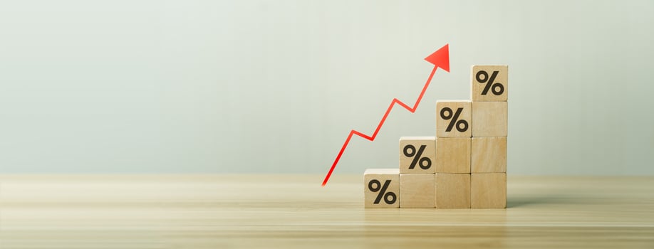 Interest rate financial and mortgage rates concept. Wooden blocks with Icon percentage symbol and arrow pointing up. company business growth and sales, interest rate, tax, real estate, inflation photo