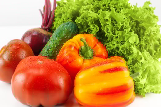 Fresh vegetables - lettuce, beets, tomatoes, cucumbers, peppers closeup. photo