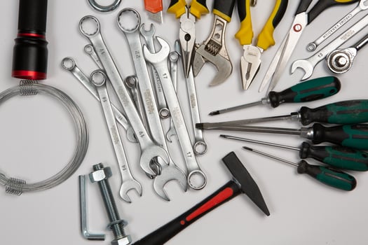 Set of tools for repair in a case on a white background. Assorted work or construction tools. Wrenches, Pliers, screwdriver. Top view photo