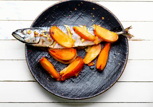 Mackerel fish baked with fruits. photo
