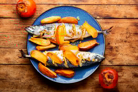 Mackerel fish baked with fruits. photo