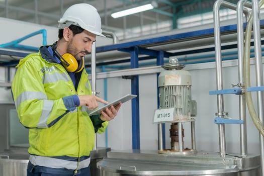 Engineers or factory managers wearing safety helmet inspect the machines in the production line. Utility inspector check machine and test the system to meet the standard. machine, maintenance. photo
