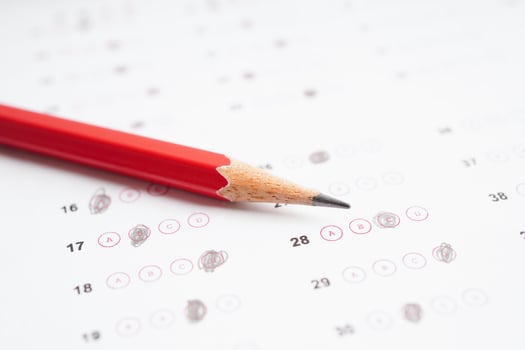 Answer sheets with pencil drawing fill to select choice, education concept. photo