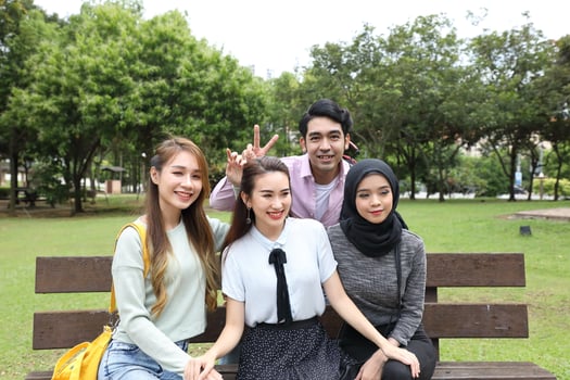 Young asian malay chinese man woman outdoor park  book file folder laptop computer phone sit stand study mingle photo