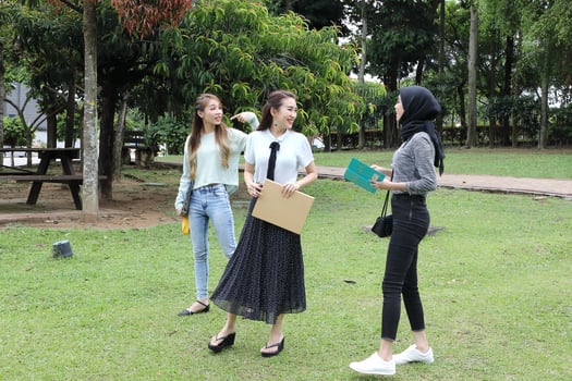 Young asian malay chinese man woman outdoor park  book file folder laptop computer phone sit stand study mingle photo