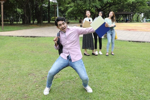 Young asian malay chinese man woman outdoor park  book file folder laptop computer phone sit stand study mingle photo