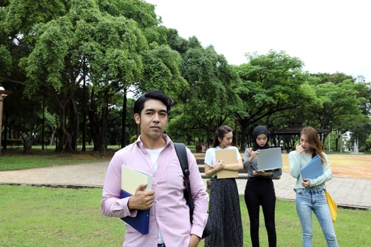 Young asian malay chinese man woman outdoor park  book file folder laptop computer phone sit stand study mingle photo