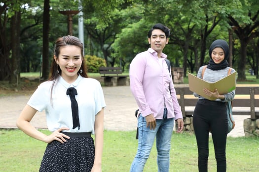 Young asian malay chinese man woman outdoor park  book file folder laptop computer phone sit stand study mingle photo