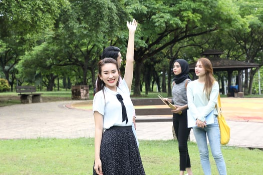Young asian malay chinese man woman outdoor park  book file folder laptop computer phone sit stand study mingle photo