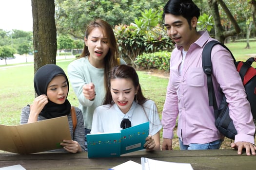 Young asian malay chinese man woman outdoor park  book file folder laptop computer phone sit stand study mingle photo