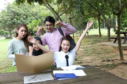 Young asian malay chinese man woman outdoor park  book file folder laptop computer phone sit stand study mingle photo