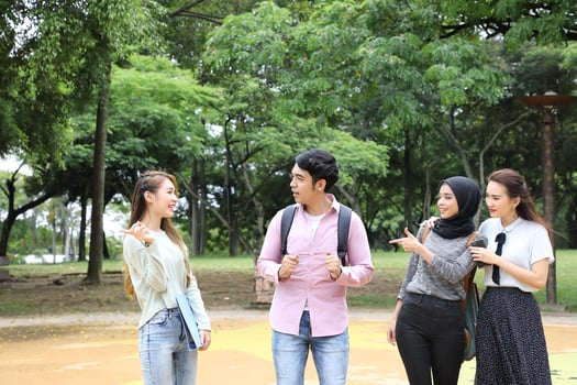 Young asian malay chinese man woman outdoor park walk stand study talk discuss point laptop file book backpack photo