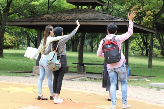 Young asian malay chinese man woman outdoor park  book file folder laptop computer phone sit stand study mingle photo
