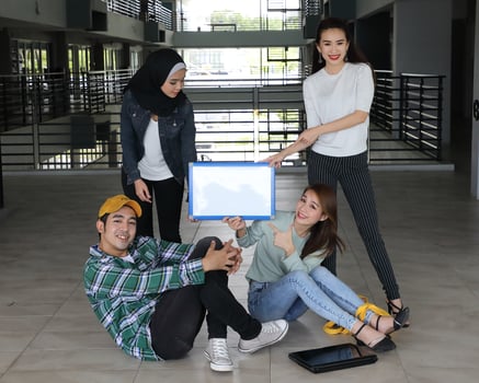 Young asian malay chinese man woman indoor stair corridor campus book file folder laptop computer phone sit stand study mingle photo