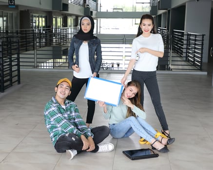 Young asian malay chinese man woman indoor stair corridor campus book file folder laptop computer phone sit stand study mingle photo