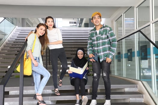 Young asian malay chinese man woman indoor stair corridor campus book file folder laptop computer phone sit stand study mingle photo