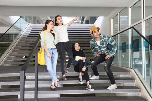 Young asian malay chinese man woman indoor stair corridor campus book file folder laptop computer phone sit stand mingle talk study photo