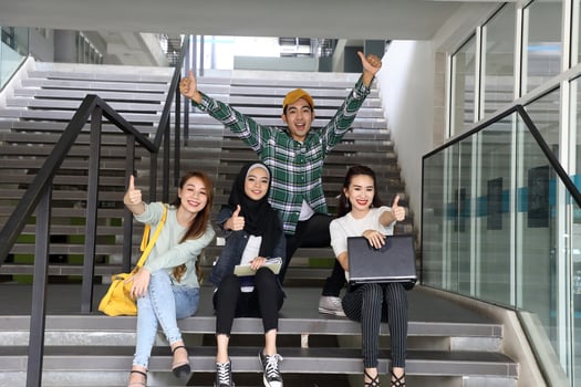 Young asian malay chinese man woman indoor stair corridor campus book file folder laptop computer phone sit stand mingle talk study joy photo