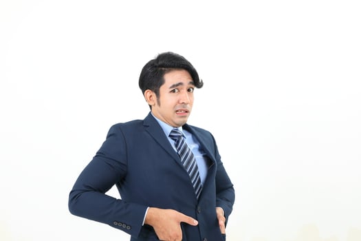 South east Asian Malay Man facial expression shocked scared afraid hand in suit pocket photo
