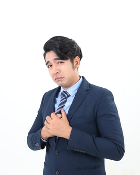 South east Asian Malay Man facial expression sad upset hand tied on chest photo