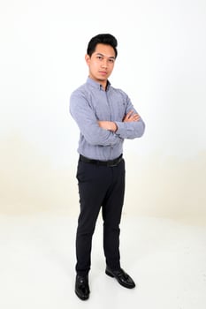 South east Asian Malay Man facial expression confident arms over chest look forward photo
