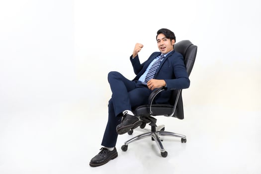 South east Asian Malay Man facial expression sit on chair confident smile photo