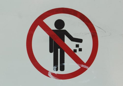 the sign abandons the garbage on white ground photo