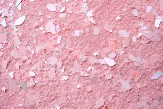 A pale pink background with silver glitter photo