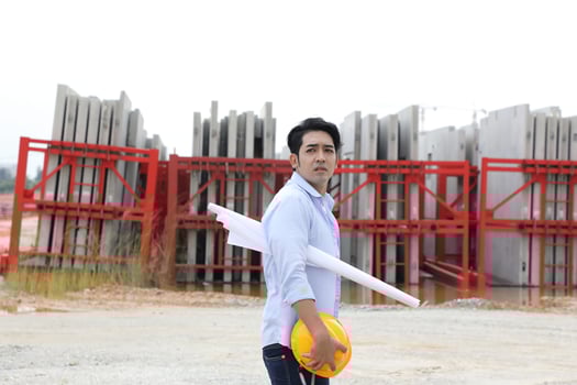South east Asian construction worker engineer management at construction site hard safety hat helmet photo