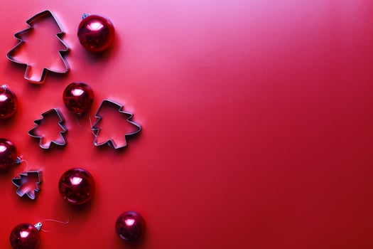 Flatly Christmas toys for the Christmas tree. Molds for gingerbread. Christmas decorations on a red background photo