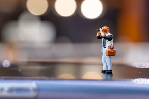 Miniature people Photography holding a camera and copy space for text photo
