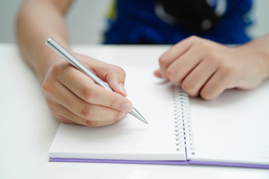 Asian teenage student write homework, study lesson for exam online learning education. photo