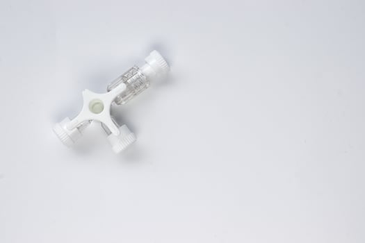 Three way stopcock with luer lock on white background. photo