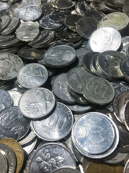 Shining and Glowing Stacked Collection of Old Indonesian Rupiah Coins photo
