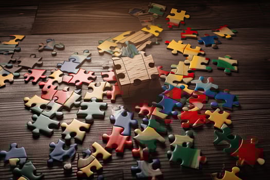 Colorful jigsaw puzzle pieces on wooden background. Business concept. Concept of finding the right solutions in life, photo