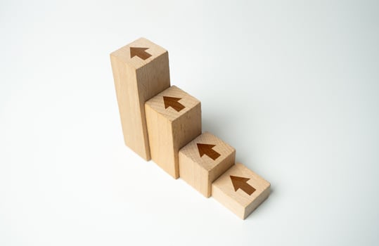 Steps with arrows going up. Growth and achieve new heights. Uptrend. Upward trend. Increasing chart. Raise and grow. Movement towards the goal. Motivation, self-development. Achieve success photo