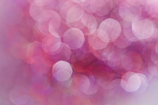 Abstract sequin background with shining festive bokeh. photo