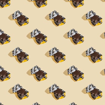 Beautiful chocolate wrapped pattern on beige background. photo