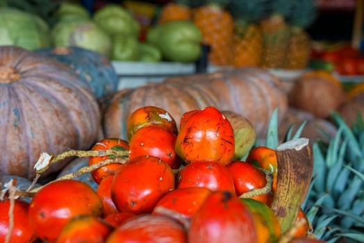 Tropical fresh ripe pejibaye fruits for sale on souvenirs stand in market photo
