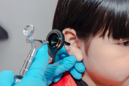 doctor using ostomoscope photo