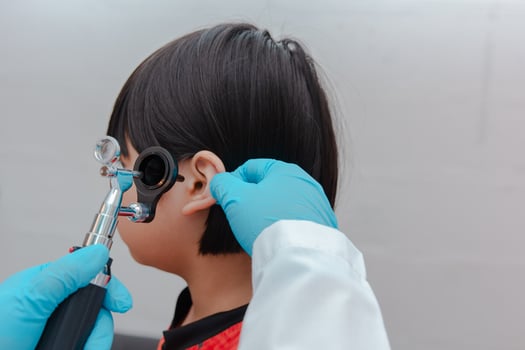 doctor using ostomoscope photo