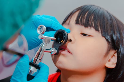 doctor using ostomoscope photo