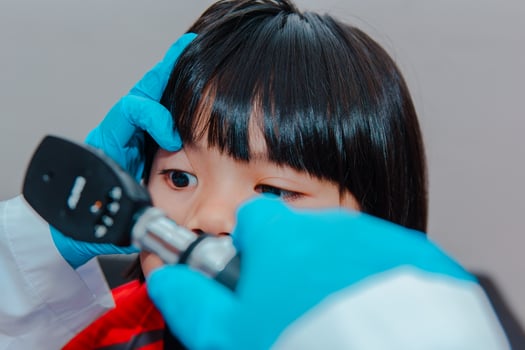 doctor using ostomoscope photo