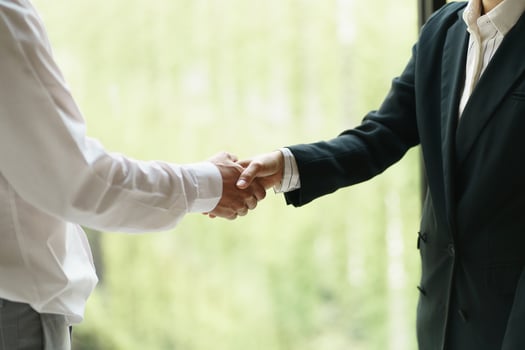 Businessman shaking hands successful making a deal. mans handshake. Business partnership meeting concept photo